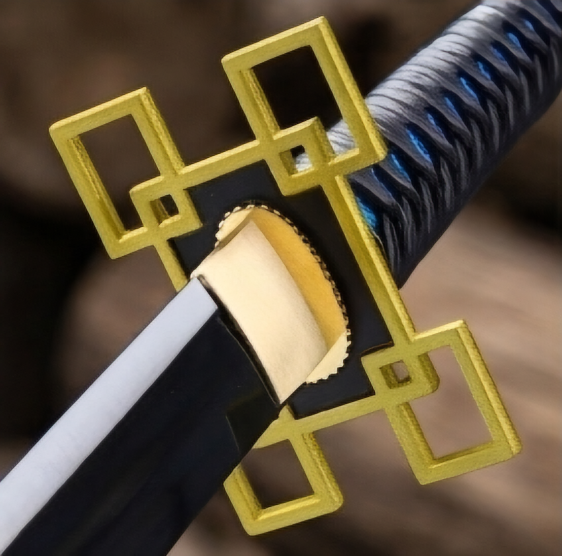 Muichiro Tokito sword geometric gold tsuba close-up, blue and black cord-wrapped handle detail